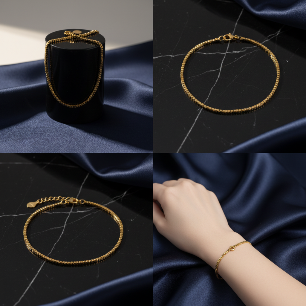 Gold box chain bracelet on dark black background with navy blue accents